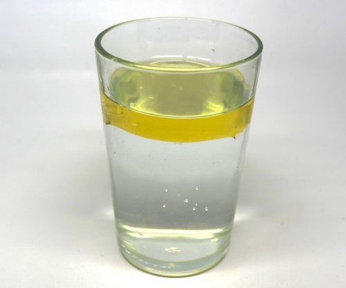 Oil and water in a glass